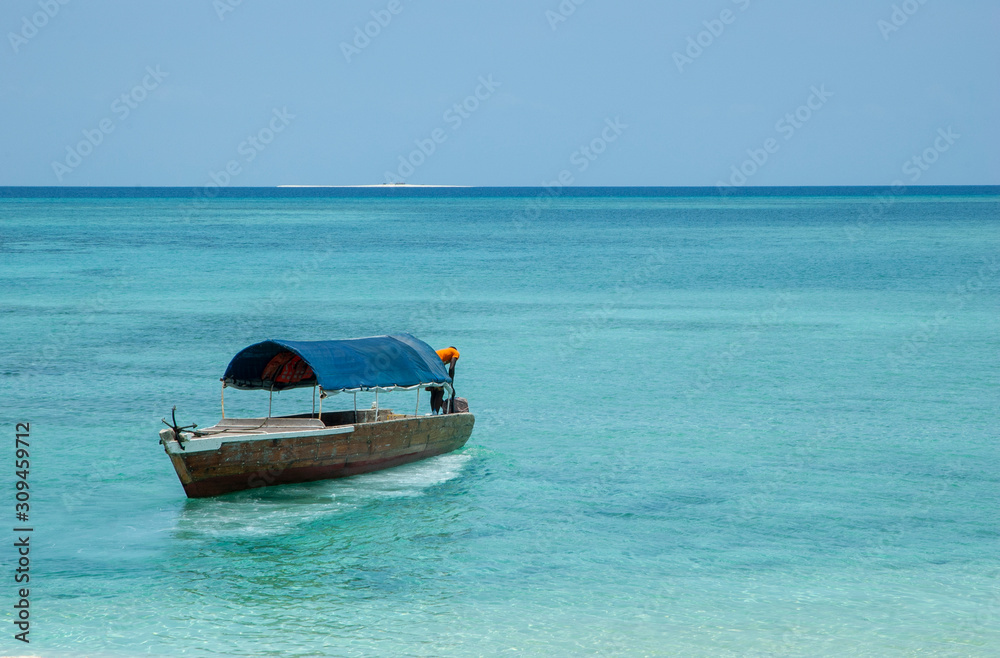 Fisherman on a coconut wood boat
