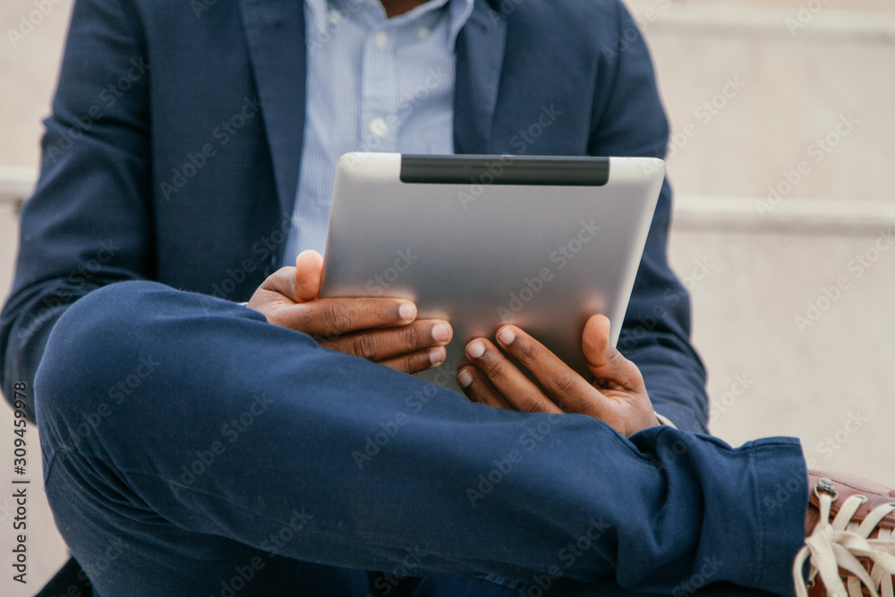 Close up of a Businessman using tablet computer Close up of a Businessman using tablet computer