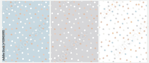 Fototapeta Simple Hand Drawn Irregular Dots Vector Patterns. Blue, Brown, White and Beige Dots on a Gray, Blue and White Background. Infantile Style Abstract Dotted Vector Print Ideal for Fabric, Textile, Cover.
