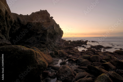 Detailed sihouette of a coastal formation at sunset.