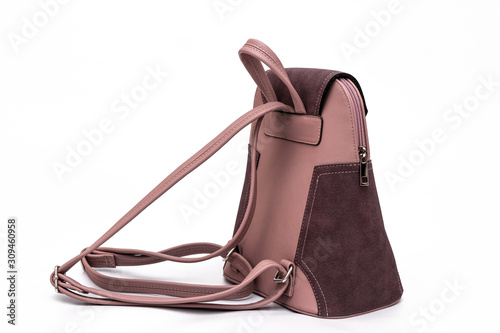Fashion women leather pink backpack isolated on a white background.