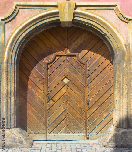Arched wooden doors