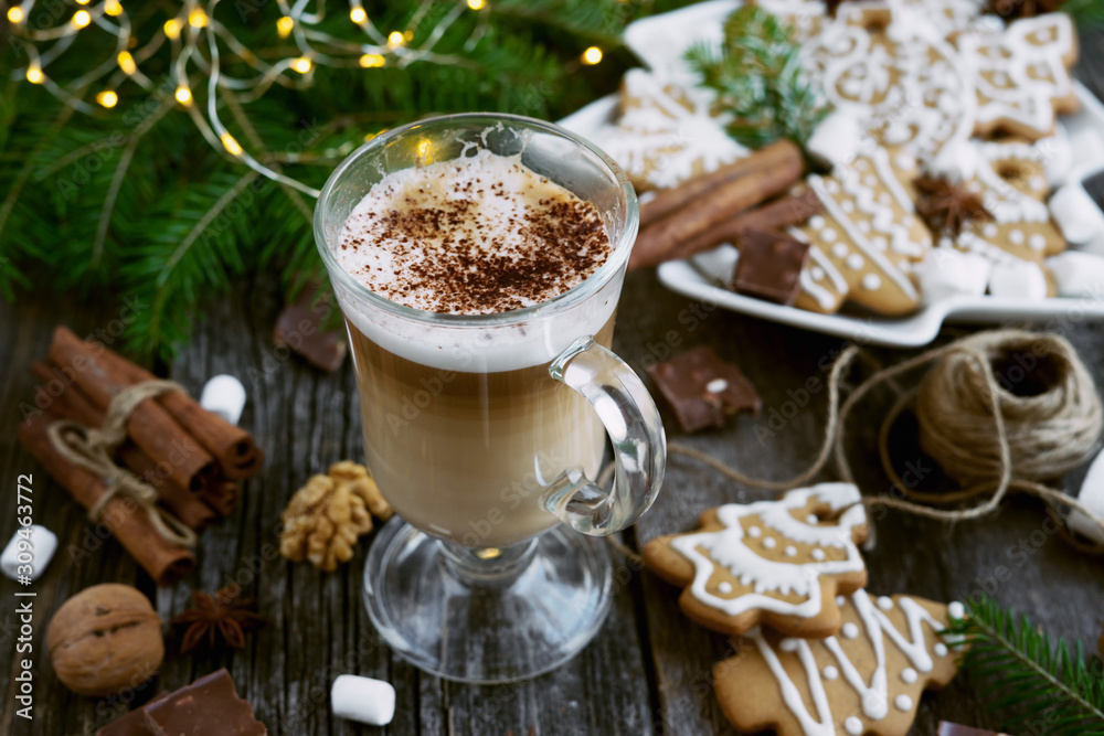 Cappuccino -coffee in transparent cup with christmas cookies
