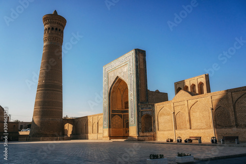View islamic religious complex of Poi Kalan located around the Kalan minaret in Bukhara at sunrise, Uzbekistan