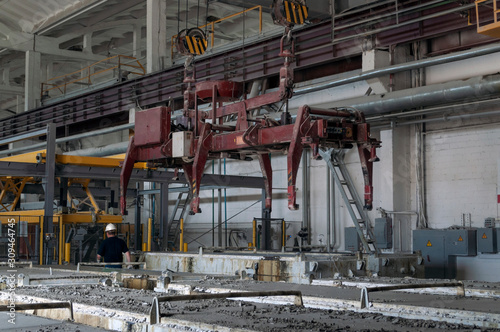 Reinforced concrete plant. Production line with crane.