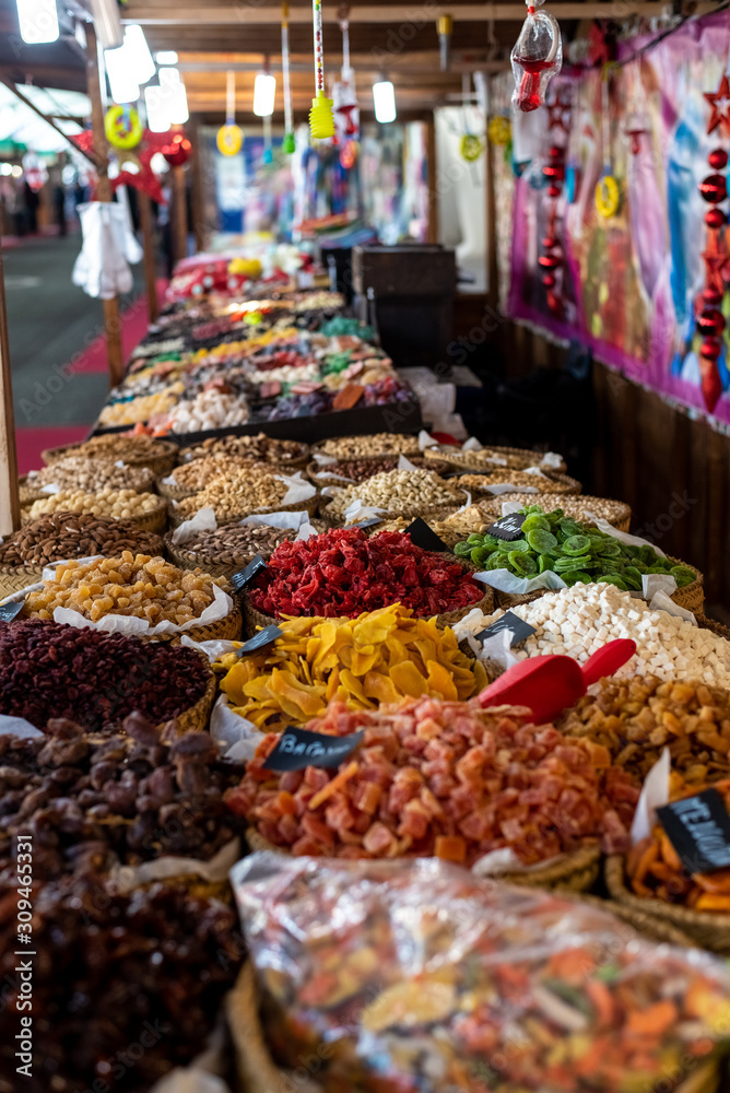 Raisins, dates and other candied fruits, sugar coated, for sale in a market.