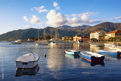 Beautiful Mediterranean landscape with boats on water. Montenegro, Adriatic Sea, view of Bay of Kotor near Tivat city photo