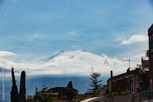 snow covered volcano Etna during abnormally cold spring, Taormina, Sicily