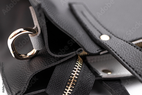 Luxury fashion women leather black handbag isolated on a white background.
