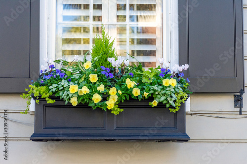 In a city of gardens, beautiful planter boxes are seen in the historic district of Charleston, South Carolina, a popular slow travel destination in the southern United States.