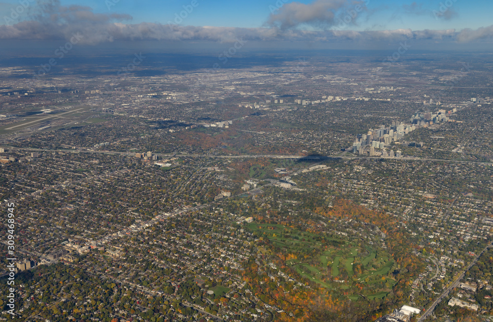 Aerial view of Toronto Yonge street and Highway 401 with Rosedale Golf club and Downsview Airport