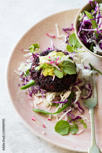 Beetroot quinoa burger with slaw and avocado crema
