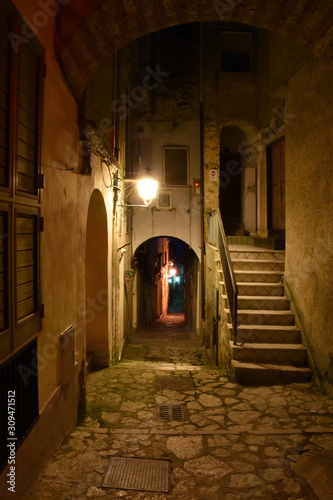 Caiazzo, Italy, 11/12/2019. A narrow street among the old houses of a medieval village