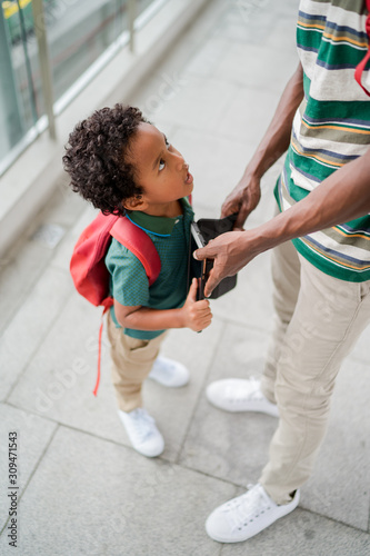 Little boy angry at his father photo