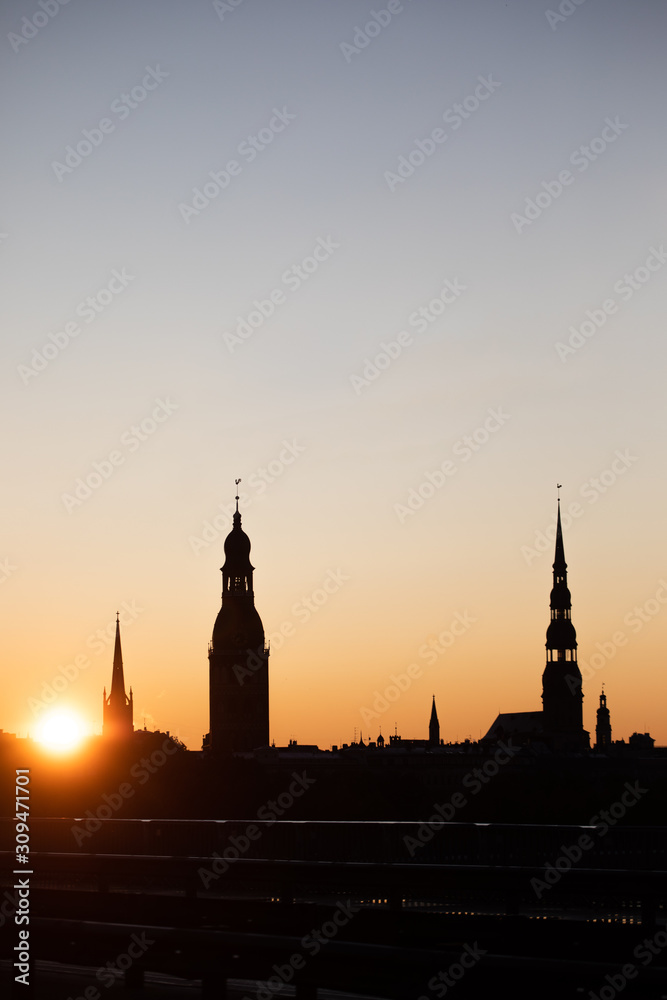 towers of Riga city at sunset