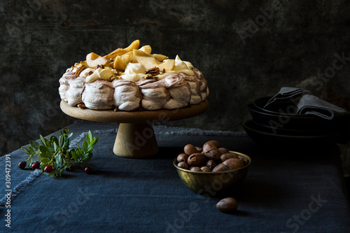 Chocolate Swirl Pavlova with Caramelized Pear and crushed pecan photo