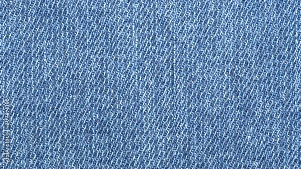 Jeans fabric plain surface background. Denim textile texture tracking. Top view. Slider shot Jeans fabric plain surface background. Denim textile texture tracking. Top view. Slider shot