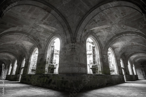 Historic ruins of abandoned abbey in black and white in Monasterio de Lugo, Galicia, Spain