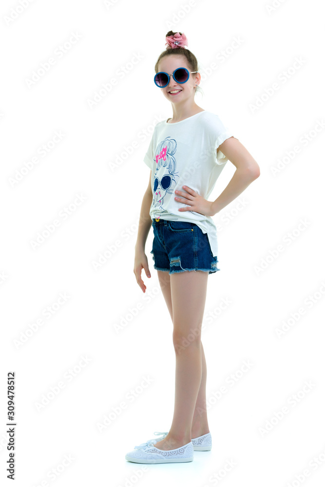 Little girl in sunglasses.The concept of youth fashion and style Little girl in sunglasses.The concept of youth fashion and style