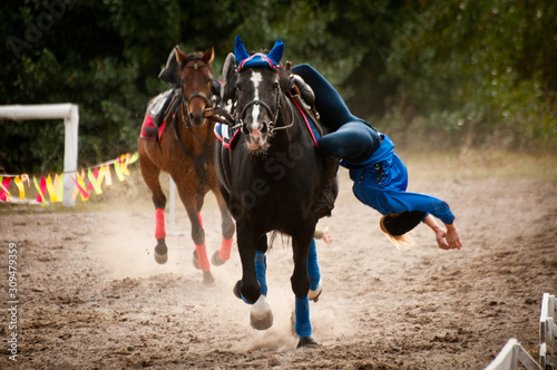 A rider on a horse shows a trick