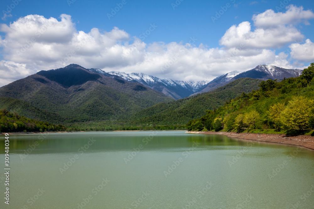 Lake in the mountains, clouds, forest, nature.