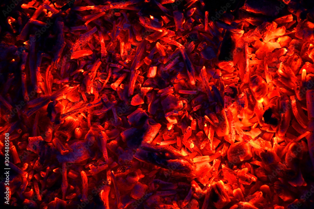 abstraction yellow-red coals smolder against the background of the night, the remains of firewood abstraction yellow-red coals smolder against the background of the night, the remains of firewood