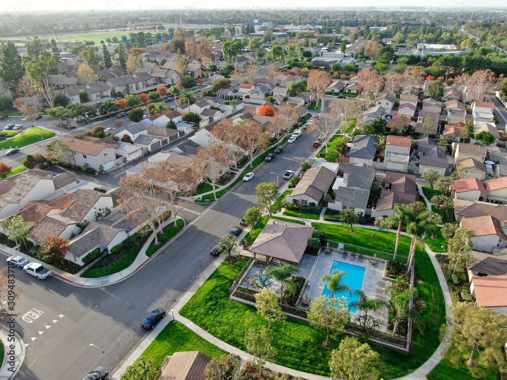 Aerial view of middle class suburban neighborhood with houses next to each other in Irvine, California, USA. Aerial view of residential area.