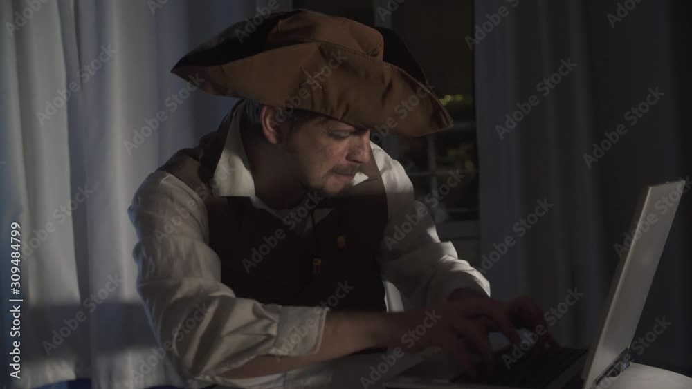 a computer pirate sitting at the laptop funny concept of digital security a computer pirate sitting at the laptop funny concept of digital security