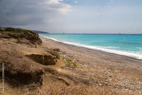 Gravel   pebble beach at the westcoast of Rhodes island near Kattavia with ocean waves