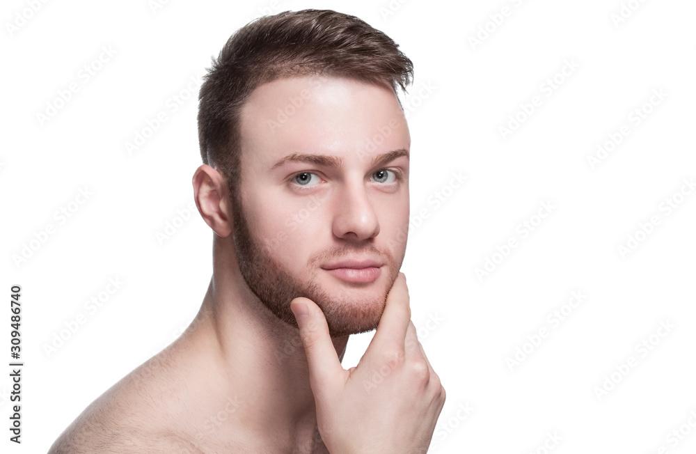 Portrait of a handsome man, with a shaved beard and mustache, and trimmed hair on white background. Cosmetology concept Portrait of a handsome man, with a shaved beard and mustache, and trimmed hair on white background. Cosmetology concept