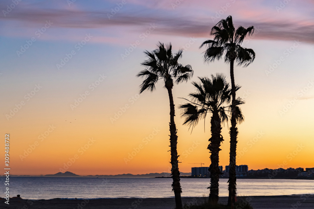 Sunset on the empty mediterranean beach. No people on spanish coast during coronavirus quarantine