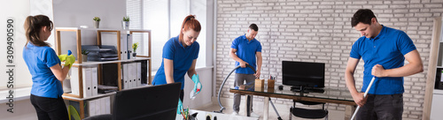 Janitors Cleaning The Office