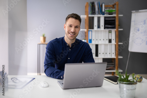 Young Man Using A Laptop