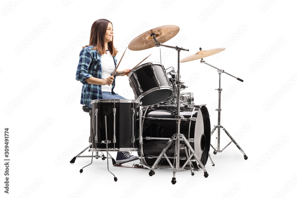 Fototapeta premium Young female drummer playing a drum set