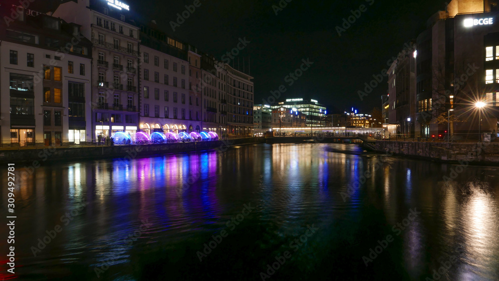 Genéve night cityscape viw over the river.