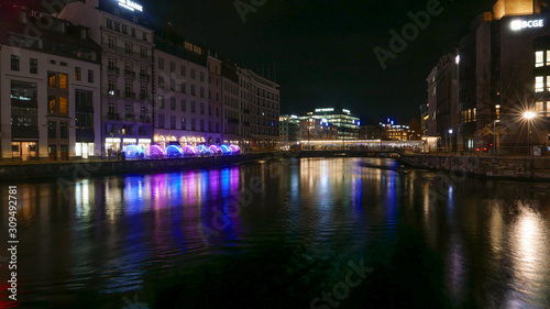 Genéve night cityscape viw over the river. © Diego