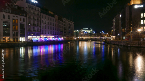 Genéve night cityscape viw over the river.