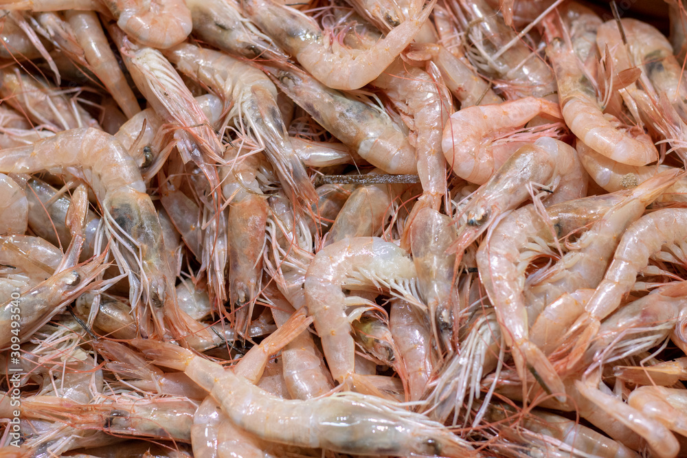 Raw fresh shrimp at the counter in the store. Raw fresh shrimp at the counter in the store.