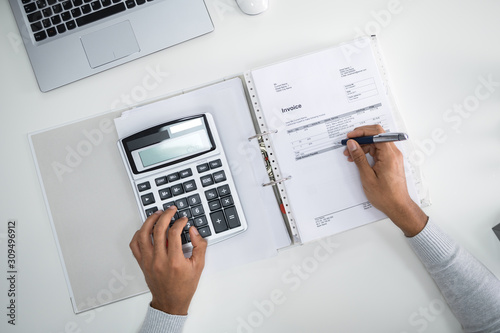 Businessman Calculating Tax