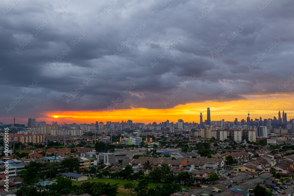 View of majestic and cloudy sunset over downtown Kuala Lumpur, Malaysia.