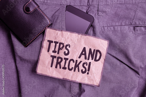 Conceptual hand writing showing Tips And Tricks. Concept meaning means piece advice maybe suggestion how improve Smartphone device inside trousers front pocket with wallet