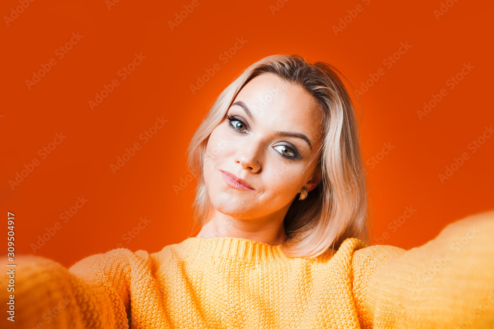 Cute blonde makes selfie on the front camera, the portrait Cute blonde makes selfie on the front camera, the portrait
