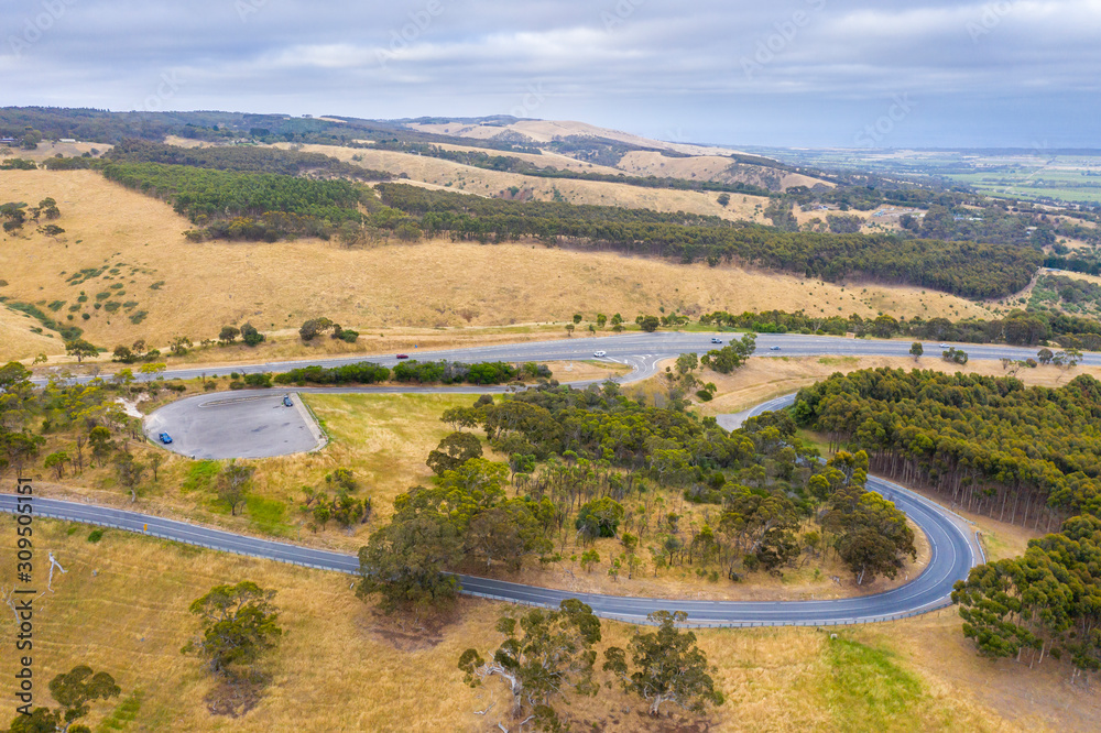 A carpark and road system running through large green farmland south of Adelaide in Australia