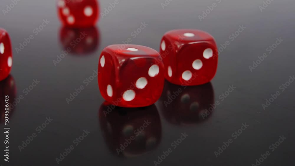 Rolling Red Casino Dice on Black Table Slow Motion Rolling Red Casino Dice on Black Table Slow Motion
