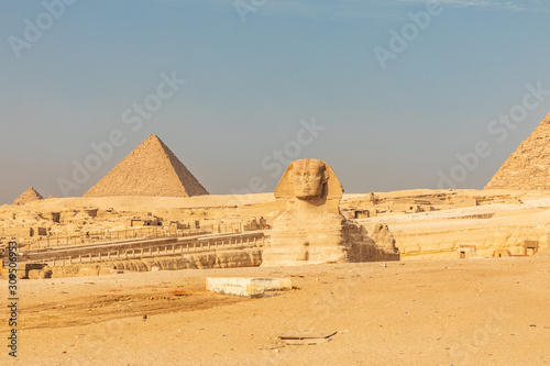 Great Sphinx of Giza in front of pyramids