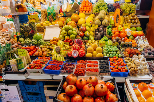 Fruit market. Lots of different fresh fruits. © EwaStudio