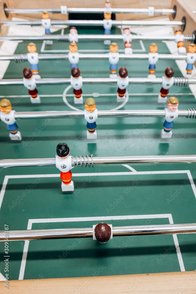 Table football game with red and blue players. Football game. Table football game with red and blue players. Football game.