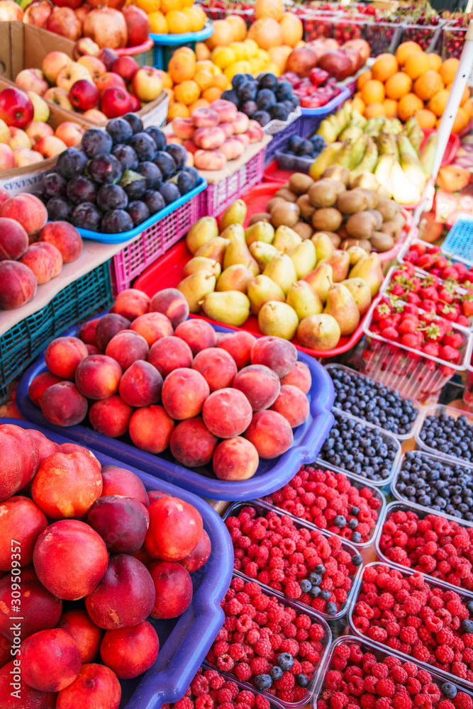 Fresh, juicy fruits at a market under the open sky Fresh, juicy fruits at a market under the open sky