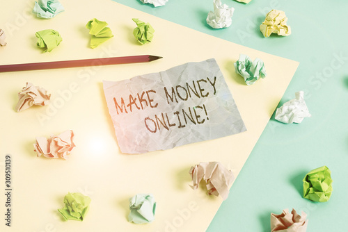 Writing note showing Make Money Online. Business concept for making profit using internet like freelancing or marketing Colored crumpled papers empty reminder blue yellow clothespin © Artur