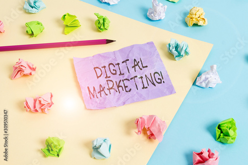 Writing note showing Digital Marketing. Business concept for market products or services using technologies on Internet Colored crumpled papers empty reminder blue yellow clothespin © Artur